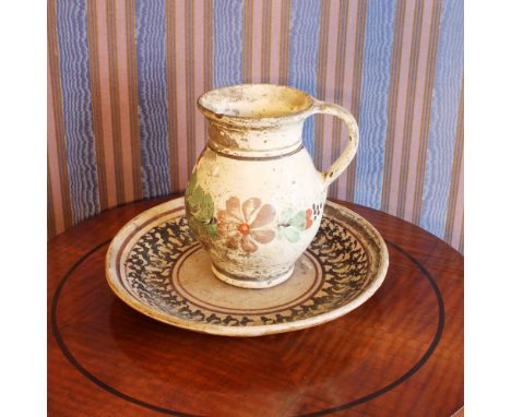 Carafe with ceramic plate Italy, 20th centurypainted in polychrome with floral motifs, defectsh. 18 cm - d. 29 cm.