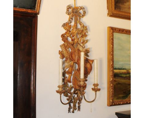 Three-light wooden applique Italy, 20th centuryPolychrome painted, carved with musical triumph90x38x23 cm.