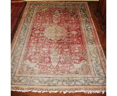 Oriental carpet 20th centurydecorated with floral and plant patterns on an orange and blue background, defects and wears284x2