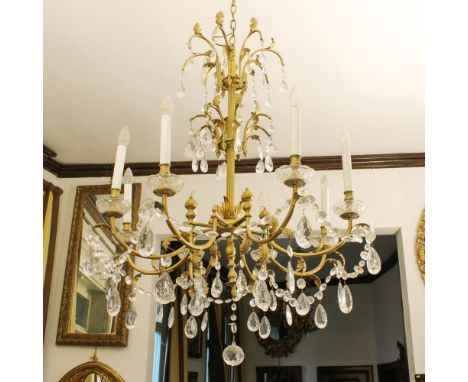 Eight lights bronze and glass chandelier Italy, 20th centuryGolden bronze structure with vegetal motifs, arms decorated with 