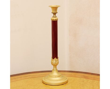Golden and lacquered bronze candlestick France, 20th centurypainted with Empire-style motifsh. 37 cm.