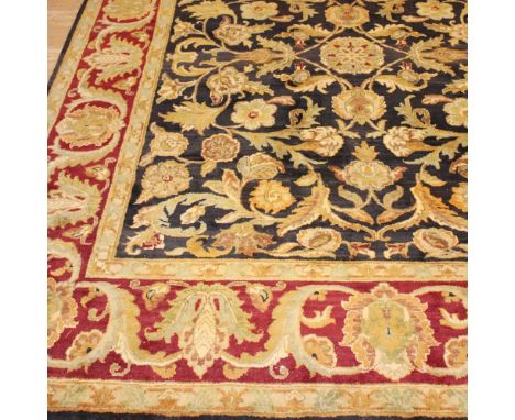 Oriental carpet 20th centurydecorated with floral and vegetal patterns on a black and red background, defects320x250 cm.