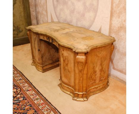 Olive wood bureau desk Italy, 20th centuryshaped structure, profiles and frame in gilded wood, front with a tablette, a drawe