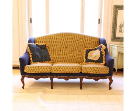 Three seater sofa in wood and fabric Italy, 20th centurystructure carved with floral, vegetal and volute motifs, fabric uphol