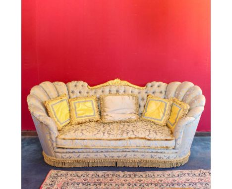 Three-seat sofa Italy, 20th centurypadded and covered in fabric, moved line body, backrest centered by an element in golden w