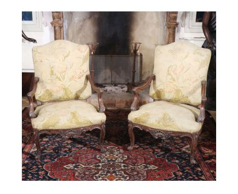 Pair of walnut armchairs France, 19th - 20th centurycarved structure with plant motifs, seats and backs in fabric105x75x60 cm