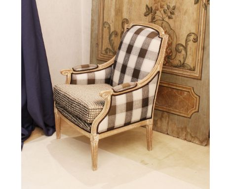 Pickled wood armchair Italy, 20th centurystructure carved with floral and volute motifs resting on truncopiramidal legs, fabr
