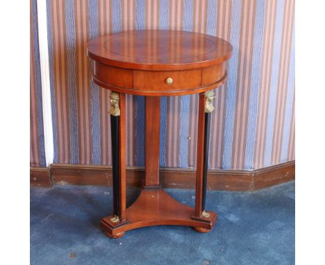 Walnut gueridon Italy, 20th centuryCircular top with a drawer below, resting on three supports with a tripod base, chiseled b