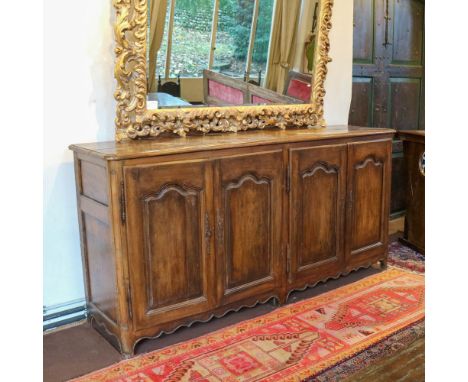 Large walnut sideboard Italy, 18th-19th centuryrectangular top with four doors underneath123x250x62 cm.