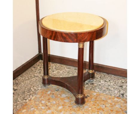 Empire style coffee table Italy, 20th centuryCircular marble top supported by three turned columns resting on a tripod base, 
