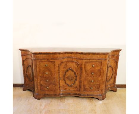 Walnut rounded sideboard Italy, 20th centurythree doors and eight drawers front, bronze handles102x229x58 cm.