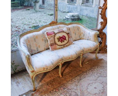 Lacquered and gilded wood sofa Italy, 20th centuryshaped line structure, decorated in polychrome with floral motifs, fabric u