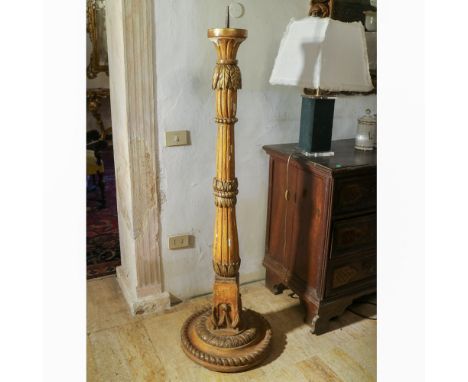 gilded and lacquered wood torchholder Italy, 19th centurybody carved with plant motifs, defects170x50 cm.