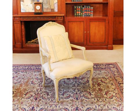 Lacquered wood armchair Italy, 20th centuryshaped structure carved with plant motifs, moved line armrests, fabric upholstered