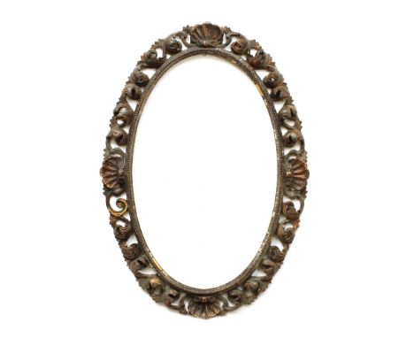 Lacquered wood mirror Italy, 20th centuryoval frame openworked and carved with shells and volutes motifs, defects and shortco