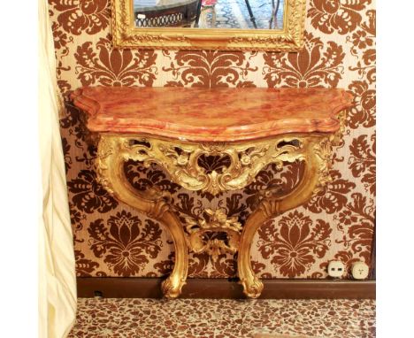 Wall console Italy, 20th centuryshaped top decorated to simulate marble, wooden structure openworked and carved with vegetal,