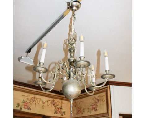 Six-lights chandelier Italy, 20th centuryin silver metal, turned structure, shaped arms with vegetal scroll motifs65x60 cm.