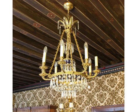 Bronze eight lights chandelier France, 20th centurychiseled body with Empire-style motifs and decorated with pendants and gla
