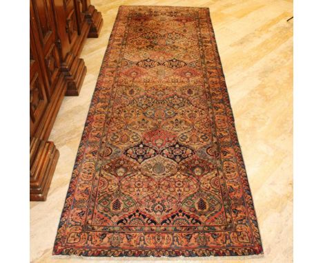 Oriental carpet 20th centurydecorated with floral and plant patterns on a multicolor background, wears and defects362x124 cm.
