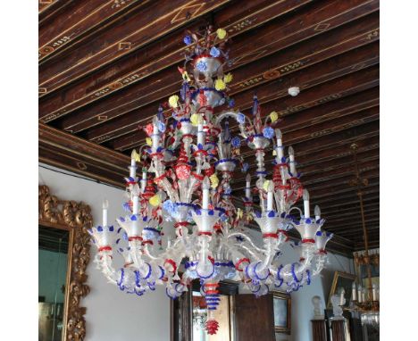 Rezzonico twenty lights chandelier Murano, 20th centuryin transparent and colored glass, wavy arms with rich decorations of l