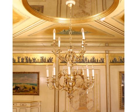 Twelve lights golden bronze chandelier Italy, 20th centurychiseled with vegetal motifs and winged Victories, shaped arms with