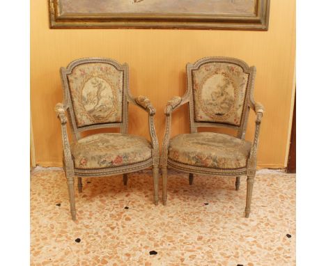 Four lacquered wooden armchairs France, 19th centuryLouis XVI line structure, richly carved with plant and floral motifs, fab