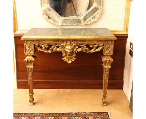 Gilded wood console Italy, 20th centuryBody openworked and carved with floral and vegetal motifs, rectangular top painted to 