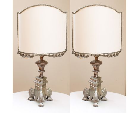 Pair of table lamps Italy, 20th centuryin silver metal, tripod body, complete with a lampshadeh. 58 cm.