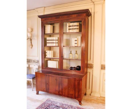 Two-body walnut sideboard Italy, 19th-20th centuryupper part with two open doors, lower part with four closed doors, slight d