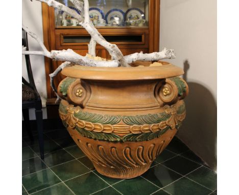 Terracotta amphora Italy, 20th centurypartially gilded and lacquered, decorated with plant garlands and pods60x84 cm.