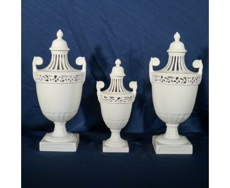 Three white polished ceramic vases Nove, Bassano 20th centuryperforated and decorated with plant motifsh.42-32 cm.