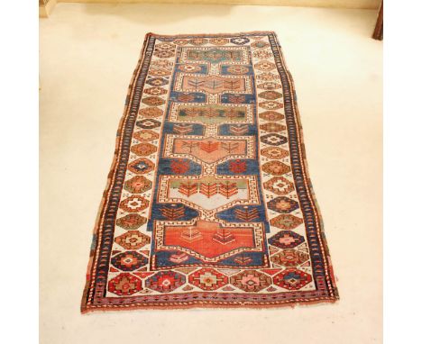 Oriental carpet 20th centurydecorated with geometric patterns on a multicolor fund, wears and defects178x94 cm.
