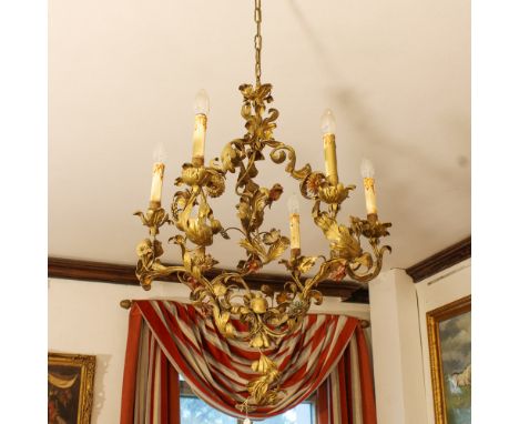 Six lights gilded iron chandelier Italy, 19th centuryforged with vegetal and floral motifs90x66 cm.