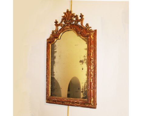 Lacquered and gilded wood mirror Italy, XVIII century.shaped line structure decorated with plant motifs and volutes, defects8