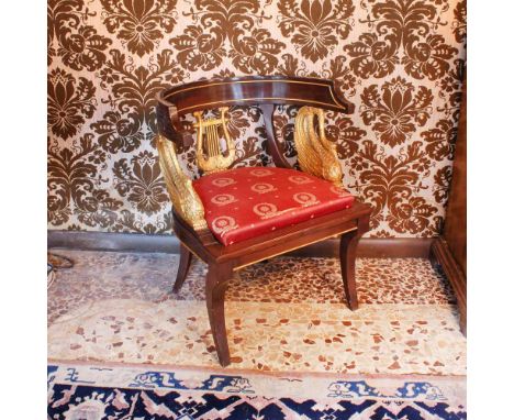 Wooden and gilded wood armchair Italy, 20th centurycurved line structure, backrest centered by a lyre and two side swans, fab