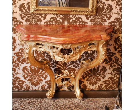 Wall console Italy, 20th centuryshaped top decorated to simulate marble, wooden structure pierced and carved with vegetable, 