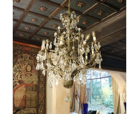 Fifteen-lights chandelier Italy, 19th-20th centuryin bronze and crystal, defects105x70 cm.