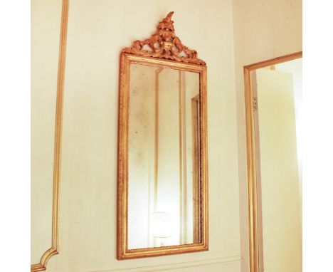 Gilded wood mirror Italy, 19th centuryrectangular frame carved with plant motifs100x40 cm.