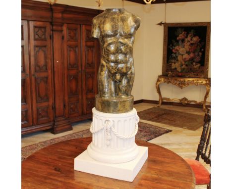 Male torso in papeier-mache Italy, 20th centuryresting on a ceramic column decorated with braided cords112x42x42 cm.