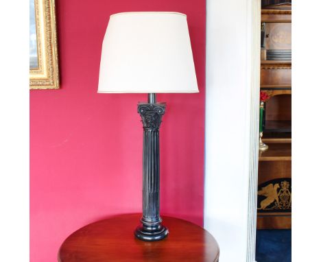 Resin table lamp Italy, 20th centurydecorated with grooved column and Corinthian capital, complete with lampshadeh. 101 cm.