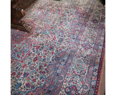 Oriental carpet 20th centurydecorated with floral patterns on a multicolor background, defects and wears470x340 cm.