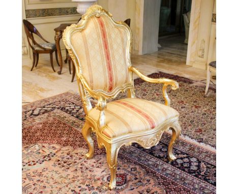 Gilded wood armchair Italy, 20th centuryshaped line structure carved with plant motifs, fabric upholstered seat and backrest1