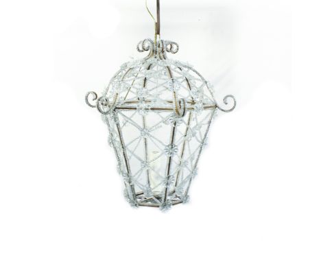 Iron and glass lantern Italy, 20th centuryhexagonal body entirely decorated with vegetal motifs and intertwined garlands60x56