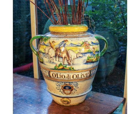 Terracotta jar Italy, 20th centurydecorated in polychrome with a landscape with herds and plant motifs58x60x44 cm.