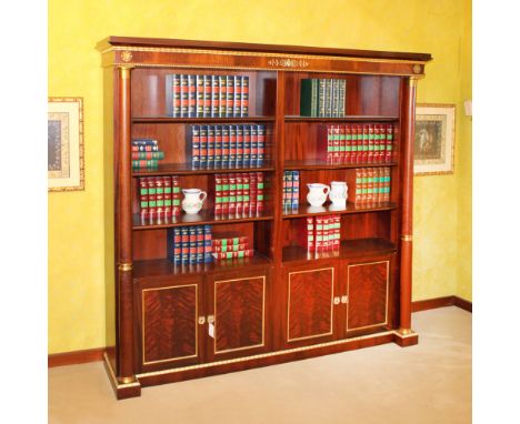 Bookcase in mahogany and mahogany feather Italy, 20th centurybody decorated with wood and gilded bronzes in Empire style moti