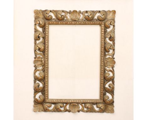 Silver wood mirror Italy, 20th centuryrectangular frame podded and carved with shells and opposite volutes motifs, defects120