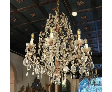Eight-lights chandelier Italy, 19th-20th centuryin wood, metal and glass80x70 cm.
