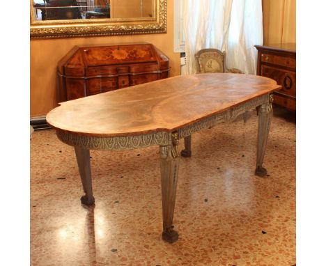 Wood and lacquered wooden centerpiece table Italy, 20th centuryshaped top richly inlaid in various woods with motifs of plant