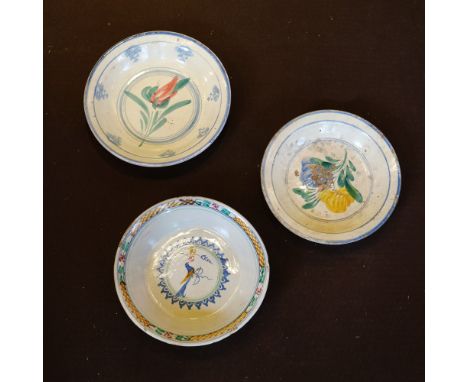 Three painted ceramic plates Italy, 20th centurywith floral, plant and scroll motifsmisure diverse
