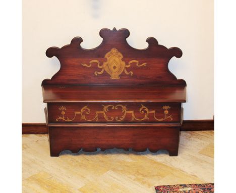 Bench in walnut stained wood Italy, 20th centuryshaped line structure decorated with coat of arms and opposite vegetal scroll